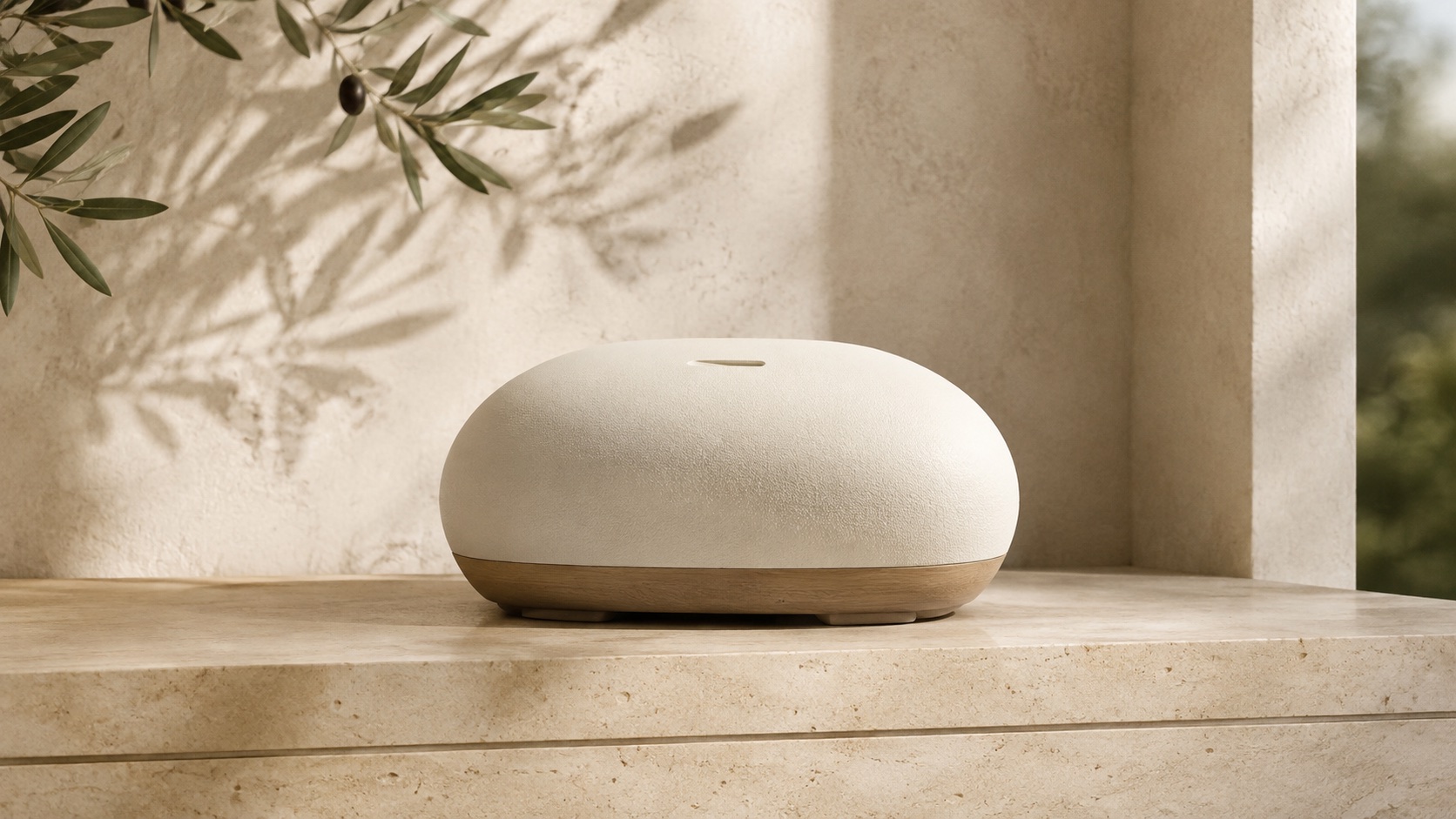 Image 1: an ivory ceramic aroma diffuser on a travertine shelf